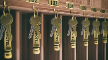 Wooden hotel reception shelf with room keys. 3d illustration